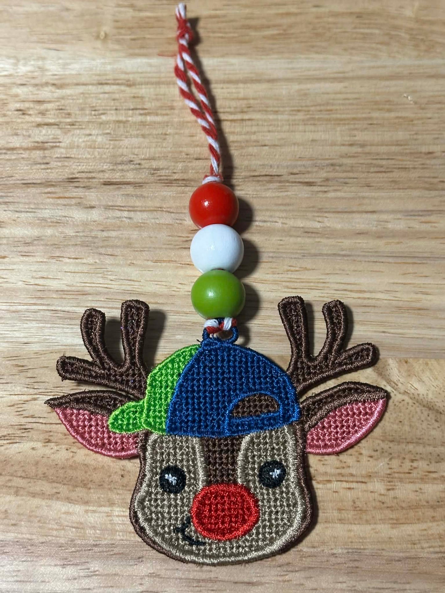 Reindeer boy with Cap ITH FSL Ornament