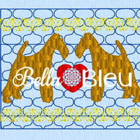 Faux smocking of Airedale dogs with a heart machine embroidery design